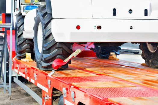 Securing heavy loads with a lashing strap on the transport platform, copy space.