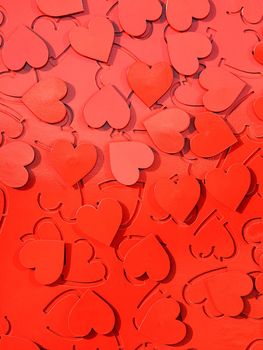 Red metal hearts in sunlight, installation of the symbol of love.