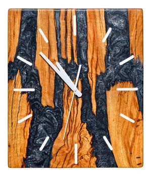 Beautiful rectangular wall clock with a tree root cut texture and black epoxy resin on the dial, imitating solidified volcanic lava. Isolated on white background.