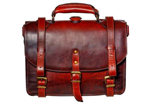 Leather red-brown briefcase with narrow straps and brass buckles in vintage style isolated on white background.