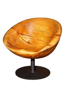 Beautiful stylish modern wooden armchair carved from solid wood and covered with oil and varnish on a metal leg, isolated on white background.