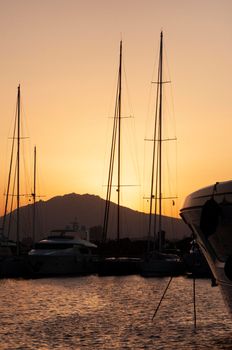 Olbia, Sardinia / Italy - 2019/8/21: Panoramic view of marina di Olbia port and yacht marina at sunset