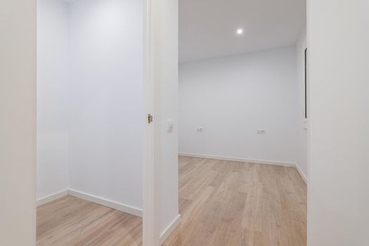 Empty small rooms with white walls. Interior of the freshly renovated room