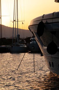 Olbia, Sardinia / Italy - 2019/8/21: Panoramic view of marina di Olbia port and yacht marina at sunset