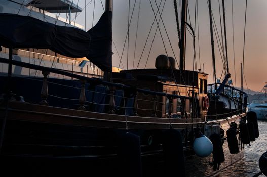 Olbia, Sardinia / Italy - 2019/8/21: Panoramic view of marina di Olbia port and yacht marina at sunset