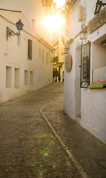 Altea, Alicante, Spain- April 24, 2022:Narrow streets and beautiful whitewashed facades on a sunny day of winter in Altea, Alicante, Spain