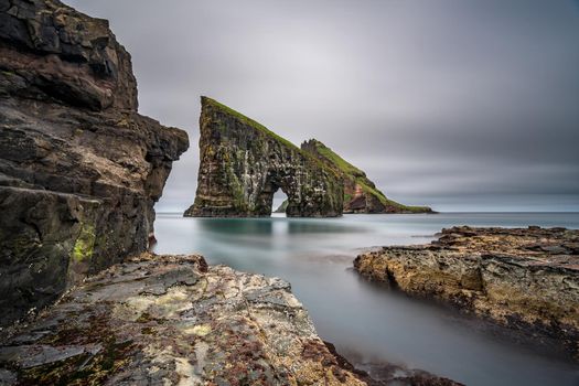 Ultra long exposure of the amazing Drangarnir gate in front of Tindholmur, Faroe Islands, Denmark.