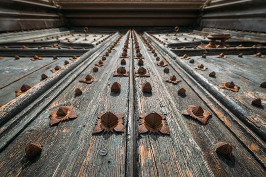 Iron details of the nothern door of entrance to the Cathedral of Girona, Spain. Bottom view with selective focus
