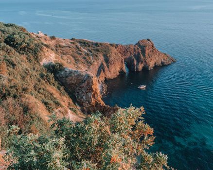 View of Cape Fiolent, Crimea, Sevastopol. Spring sunny day, flowering yellow bush. The concept of calm, silence and unity with nature