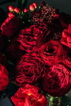 Bright red flowers bouquet on dark background.