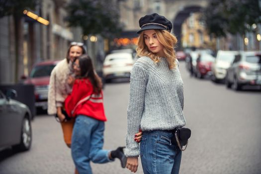 Girls walk down the street in the city