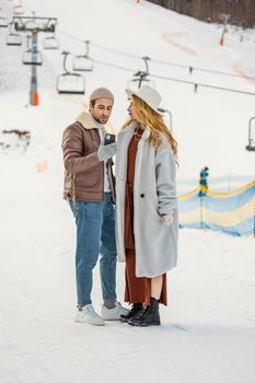 couple taking a selfie on the background of the lift