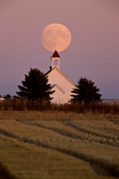 Old Country Church in Saskatchewan full harvest moon