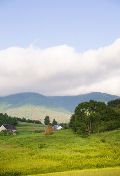 Haystack summer in the beautiful village Ukrainian Carpathians