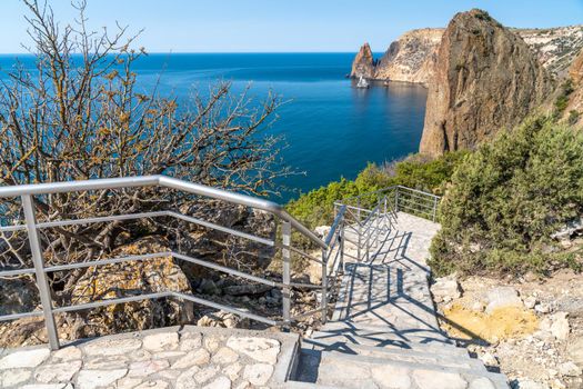 A new stone staircase of 800 steps to Jasper Beach, built in the spring of 2020. The reserve on the Black Sea. Cape Fiolent, Crimea Peninsula. The concept of unity with nature, outdoor activities