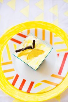 bright colored dessert plate and a yellow napkin