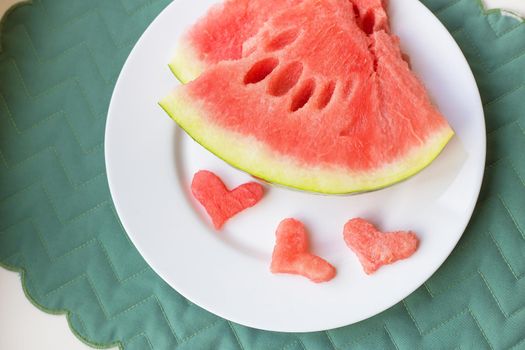 close-up on the table is a piece of watermelon