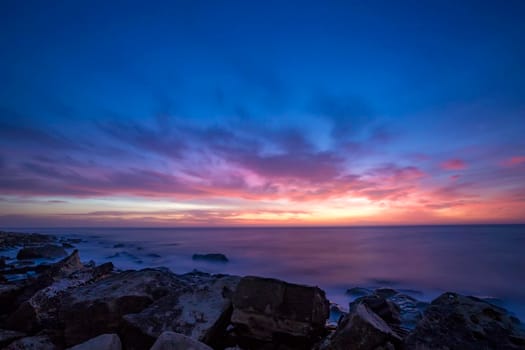 Seascape during sunrise. Beautiful natural seascape, blue hour. Sea sunrise at the Black Sea coast. 