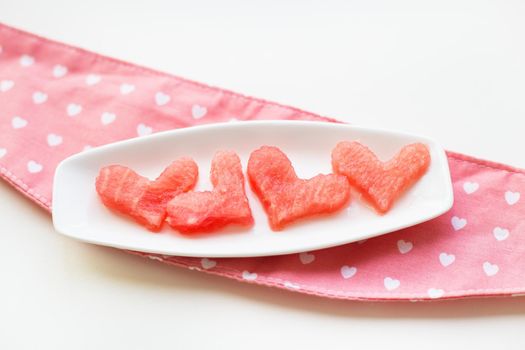 heart-shaped watermelon on a plate top view