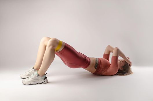 the athletic girl posing in the Studio on a white background