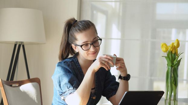 successful Young leader Woman in glasses Chatting Laptop Living Room. Writing Searching Using IT. Happy smiling Buisenes Lady Working leads conference Browsing Internet. Education, Technology Concept.