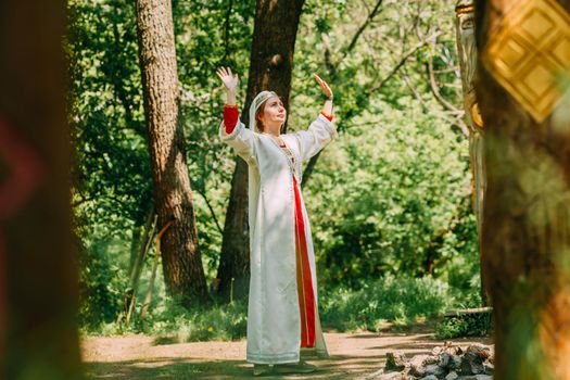 happy woman pagan priestess prepared for the ceremony. old faith in our time. seasons, summer