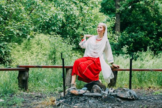 happy woman pagan priestess prepared for the ceremony. old faith in our time. seasons, summer