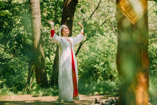 happy woman pagan priestess prepared for the ceremony. old faith in our time. seasons, summer