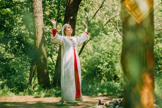 happy woman pagan priestess prepared for the ceremony. old faith in our time. seasons, summer