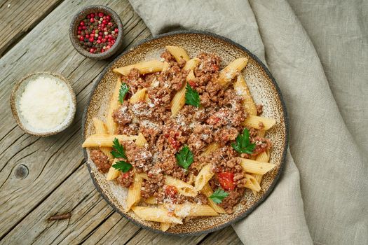 Bolognese pasta. Fusilli with tomato sauce, ground minced beef. Traditional italian cuisine. Top view.