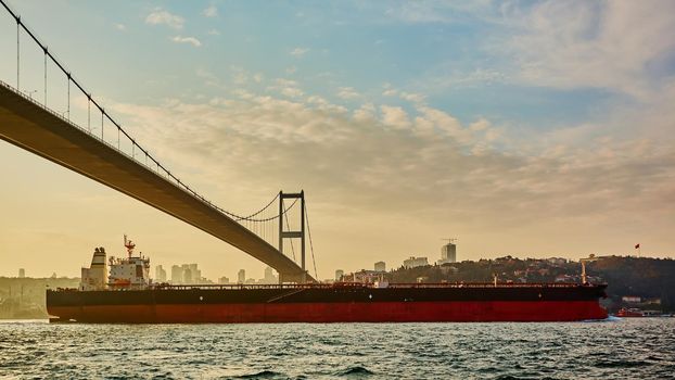 Cargo ship tanker in Bosphorus Strait about to pass under Bosphorus bridge in Istanbul, Turkey