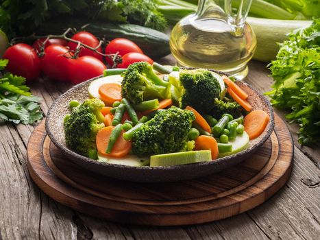 Mix of boiled vegetables, steam vegetables for dietary low-calorie diet. Broccoli, carrots, cauliflower, side view.