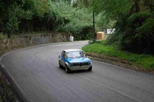 PESARO COLLE SAN BARTOLO , ITALY - OTT 10 - 2021 : BMW 2002 on an old racing car ifor rally