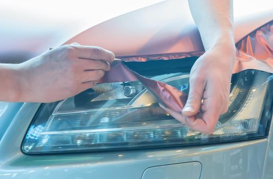 pasting of car carbonic plastic closeup