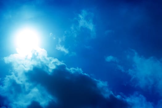 Beautiful dark sky with sun and clouds