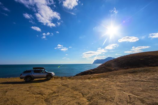 off-road vehicle on the high coast of the sea