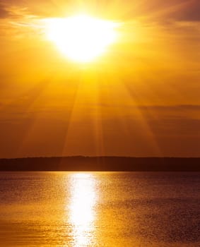 beautiful golden sunset in the cloudy sky over the sea