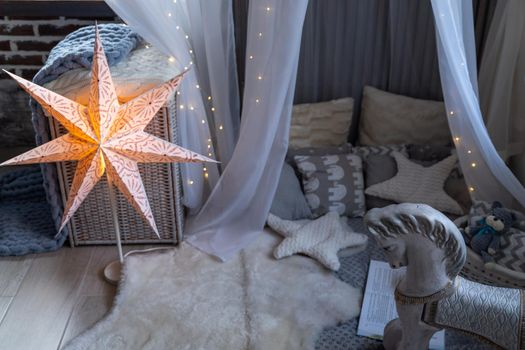 Childen's room corner with a beautifully decorated play tipi tent. Wigwam.