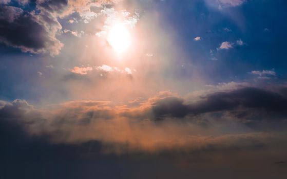 Beautiful Dark Sky with Sun and Clouds