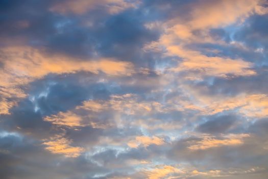 Heavenly landscape. Cloudy sky illuminated by sunset sunlight