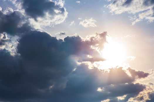 Beautiful dark sky with sun and clouds