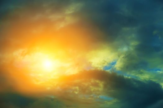 Sun rays look through dark cirrus clouds.