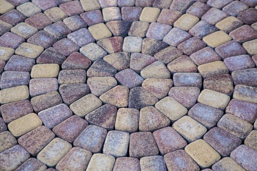 pavement of rough granite tiles in radial packing