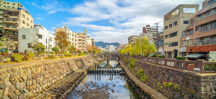 Nagasaki city downtown skyline cityscape with Megane Spectacles Bridge in Kyushu Japan
