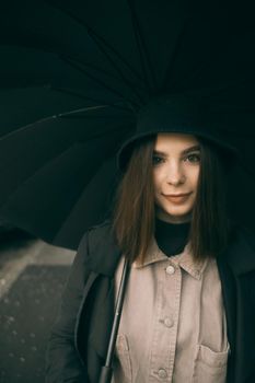 Emotional portrait, girl with umbrella, emotion - reaction to surprise, fright