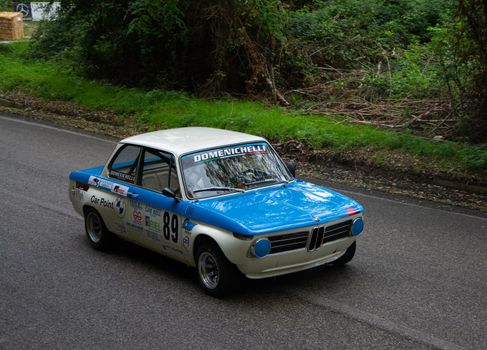 PESARO COLLE SAN BARTOLO , ITALY - OTT 10 - 2021 : BMW 2002 on an old racing car ifor rally