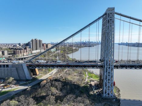 Aerial view of George Washington Bridge in Fort Lee, NJ. George Washington Bridge is a suspension bridge spanning the Hudson River connecting NJ to Manhattan.