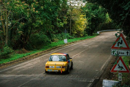 PESARO COLLE SAN BARTOLO , ITALY - OTT 10 - 2021 : BMW 2002 on an old racing car ifor rally