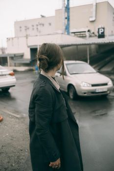 woman walking in rain weather