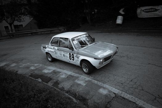 PESARO COLLE SAN BARTOLO , ITALY - OTT 10 - 2021 : BMW 2002 on an old racing car ifor rally